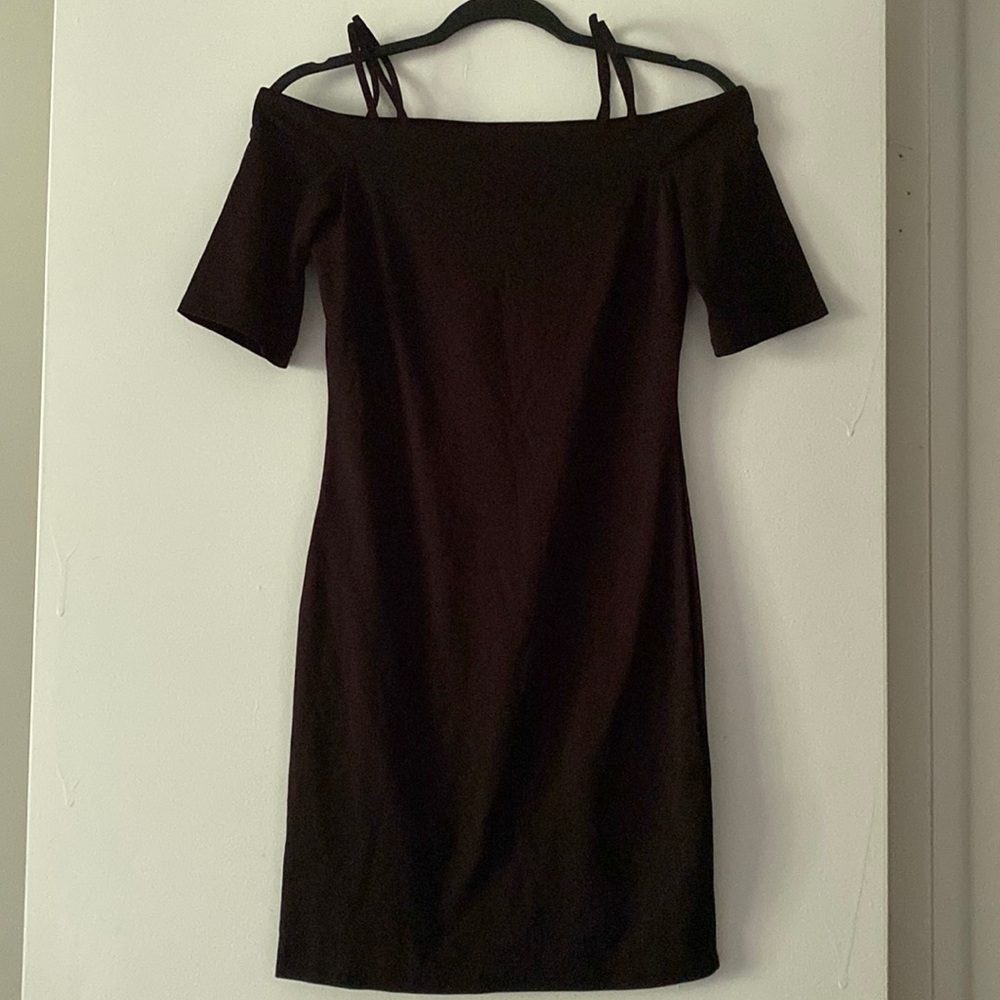 Off the shoulder mini black dress.